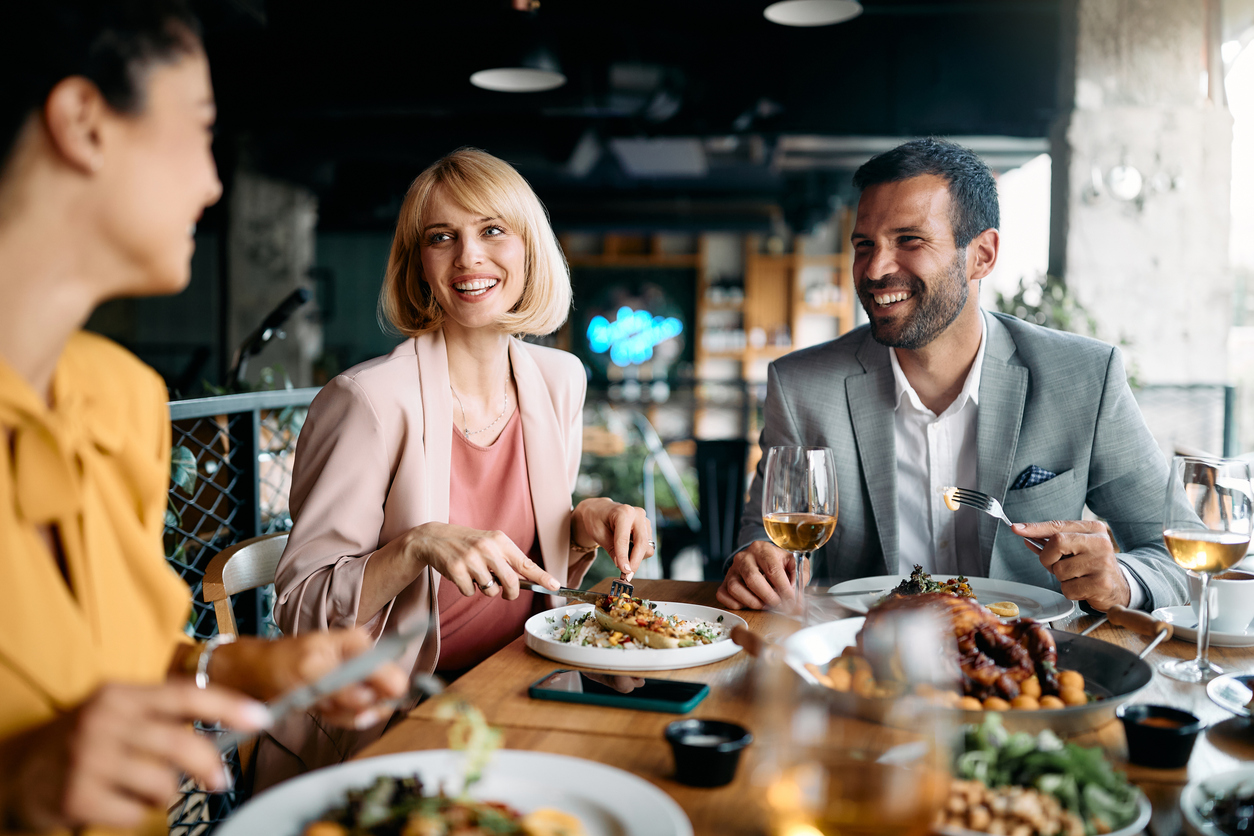 a group of colleagues eating lunch at a restaurant
