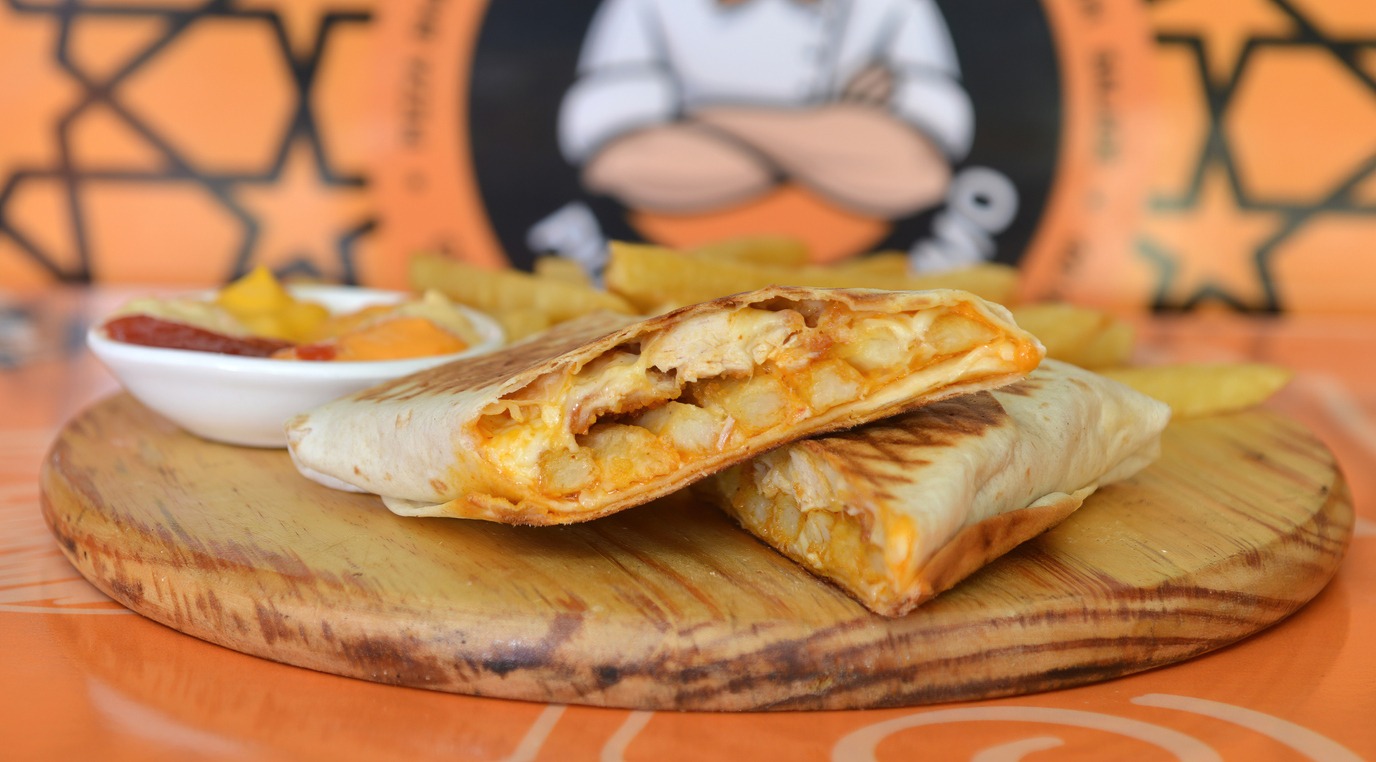 French tacos with chicken, served with French fries, mayonnaise, ketchup and mustard