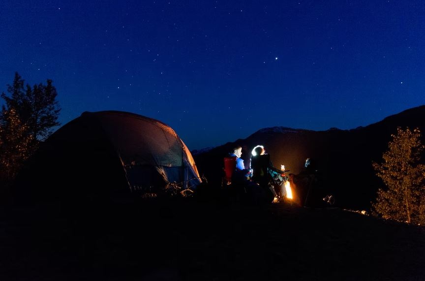 Photo of campers looking at the sky