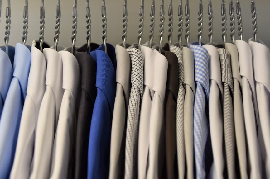 shirts hanging in a clothes rack