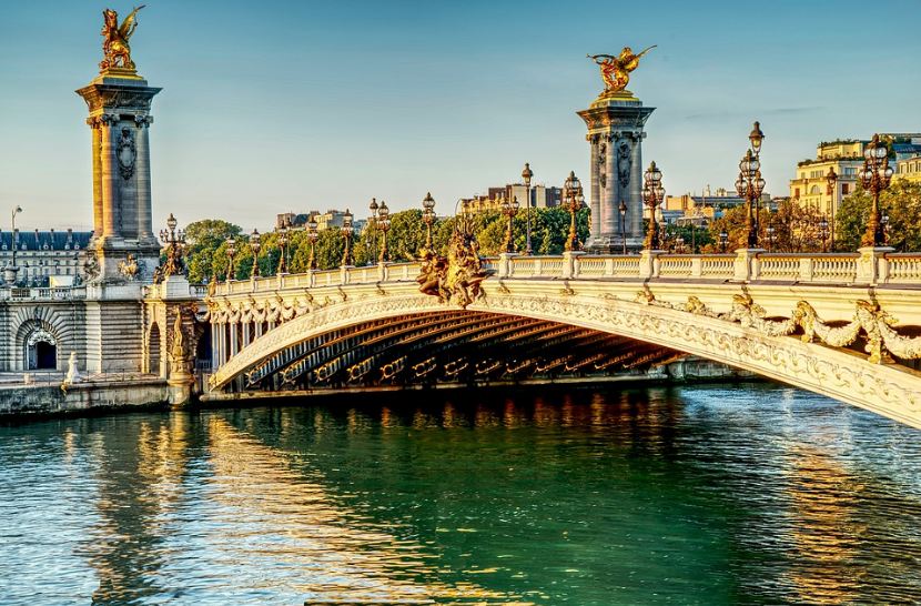 Le-Pont-Alexandre-III-bridge-river-monument-buildings-trees-blue-sky