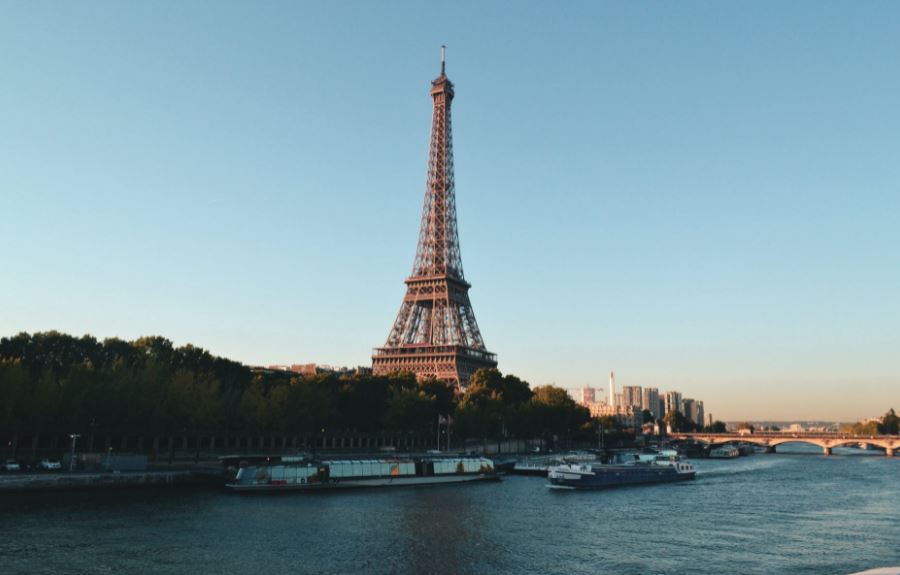 the-Eiffel-tower-river-bridge-boats-trees-buildings
