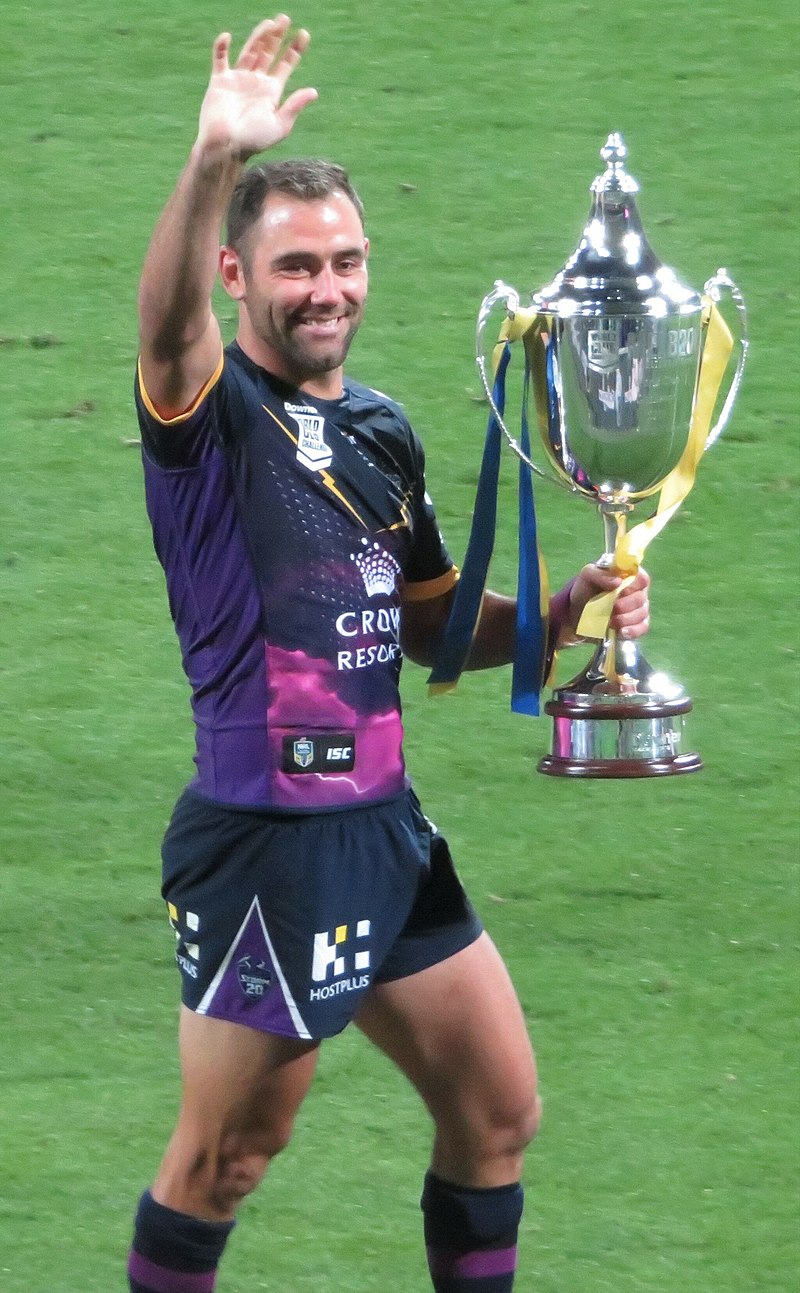 Cameron Smith holding a championship trophy