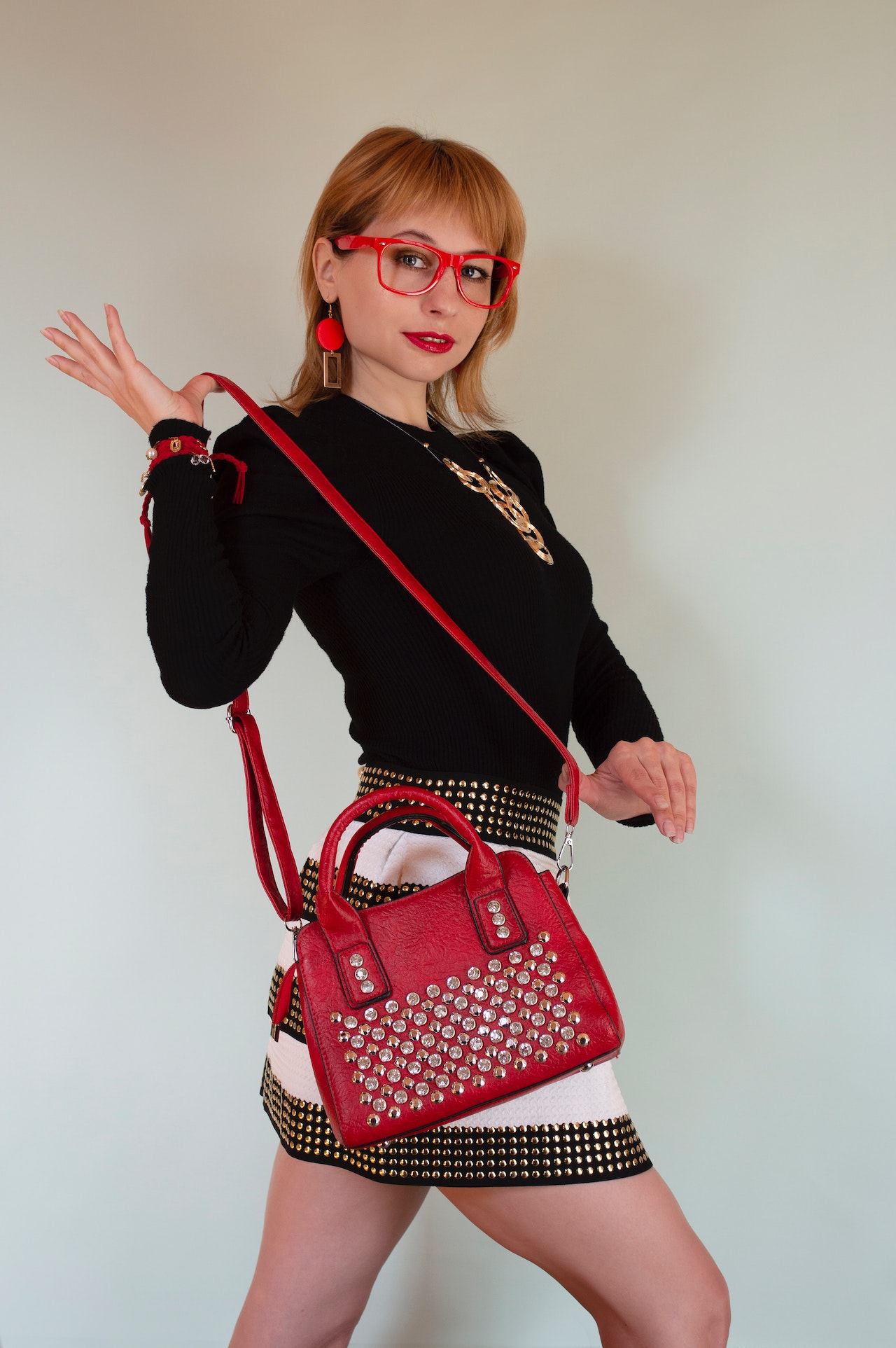 How to Style a Red Designer Bag?